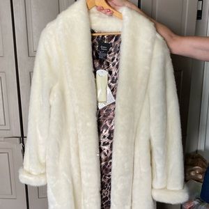 White Faux fur 50” long coat. New with tags